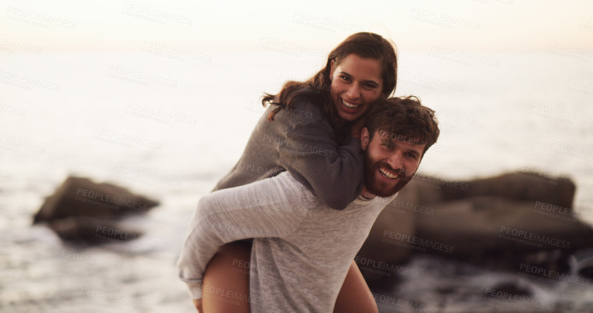 Buy stock photo Beach, love and happy couple laugh with piggyback on holiday, vacation or date together. Portrait, man and carry woman at sea for romance, connection and travel with excited partner outdoor at space