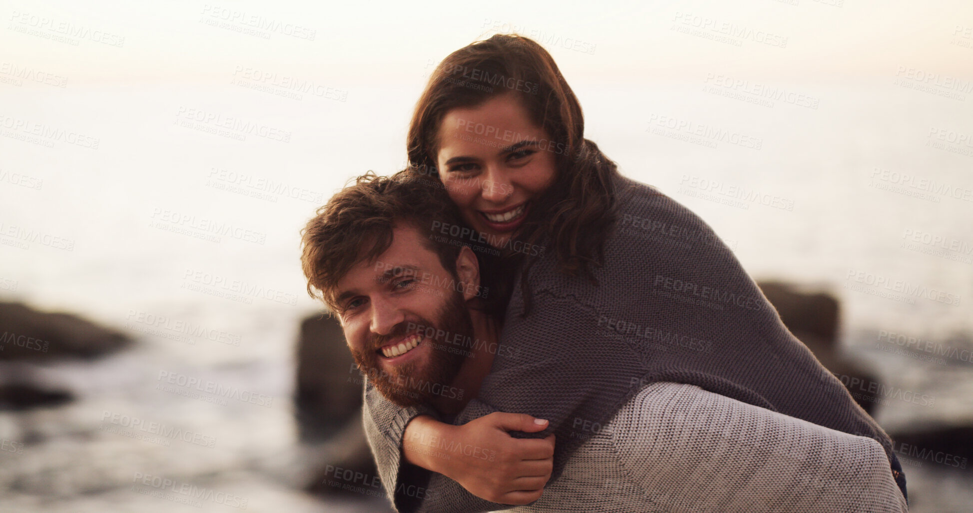 Buy stock photo Beach, love and portrait of happy couple with piggyback on holiday, vacation or date together. Smile, man and woman with hug at ocean for romance, connection and travel with partner outdoor in summer