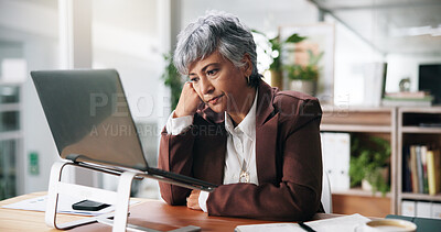 Buy stock photo Bored, laptop and reading with business woman at desk in office for brain fog or mental fatigue. Computer, exhausted and tired with mature employee in workplace for administration, report or review