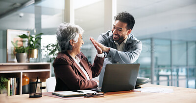 Buy stock photo Business celebration, laptop and people with high five for trading success, sales goal or teamwork. Excited man, mature woman and tech with support in office for stock market growth and achievement