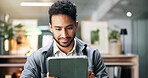 Creative man, reading and tablet in office for planning, proofreading story and editor feedback. Person, journalist and digital for research, article headlines and information on publication schedule