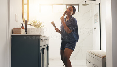 Buy stock photo Black woman, brush and singing in bathroom, happy and performance with morning routine at home. African person, song and karaoke with voice, dance and hair care for grooming with music at apartment