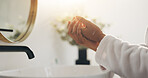 Home, washing hands and woman in bathroom, hygiene and routine with skincare, faucet and morning. Closeup, apartment and person with tap, lens flare and remove bacteria with wellness and cleaning