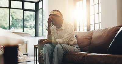 Buy stock photo Tired, headache and thinking with black woman on sofa for fatigue, burnout and mistake. Mental health, exhausted and reflection with female person in living room of home for perspective and migraine