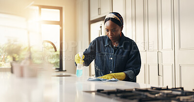 Buy stock photo African woman, cloth and cleaning at house with detergent, sanitizing counter and remover dirt. Female person, bottle and wipe table for housekeeping, prevent bacteria and liquid for hygiene safety