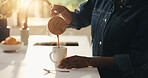 Person, hands and pour with coffee in kitchen for morning drink or warm beverage in home. Homeowner, pot and caffeine with mug, cup or dispenser for latte, cappuccino or house espresso on countertop