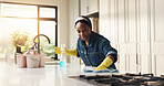 Smile, woman and cloth for cleaning at house with detergent, sanitizing counter and remover dirt. Happy, female person and wipe table for housekeeping, prevent bacteria and liquid for hygiene safety