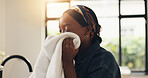 Black woman, smell and fabric with clean laundry in home for comfort, washing or fragrance. Female person, fresh scent or housewife with soft cloth for hygiene, clothing detergent or aroma in house
