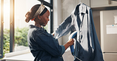 Buy stock photo Home, black woman and steam shirt for laundry, hygiene or happy for chores or housework. African person, appliance or steamer for clothes, fabric maintenance or cleaning to remove wrinkles in kitchen