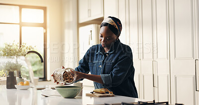 Buy stock photo Home, pour cereal and black woman in kitchen, morning and breakfast with vegan meal. African person, apartment and prepare food in bowl, healthy diet and hungry with wellness, organic and nutrition