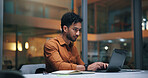 Laptop, typing and man in office at night with finance report deadline for company budget planning. Computer, research and male financial advisor with investment proposal for client in workplace.