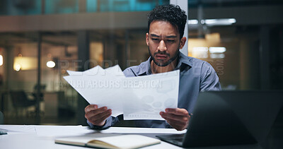 Buy stock photo Business, man or serious with paperwork in office for financial review, invoices or compliance risk. Bookkeeper, worried person and laptop with statements for budget forecasting, bankruptcy and night