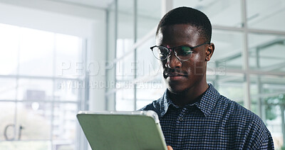 Buy stock photo Black man, tablet and scroll at startup, review or reading report for proposal, notes or list in office. African person, tech and app for contact, feedback or notification for deal at creative agency