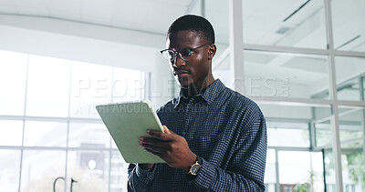 Buy stock photo Black man, tablet and thinking at office, startup and reading report for proposal, review or solution. African person, tech or smile with app, feedback or notification with glasses at creative agency