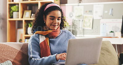 Buy stock photo Laptop, happy and woman on sofa in home with typing for university assignment in living room. Education, computer and female student with research for college project, study or online test in house.