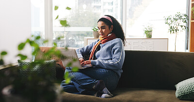 Buy stock photo Woman, laptop and relax on sofa, home and streaming service for movies, video or series in lounge. Girl, computer and scroll with subscription, film and chill on couch in living room at apartment