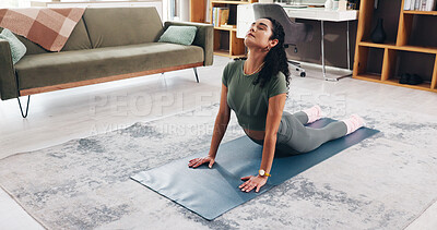 Buy stock photo Woman, stretching and yoga for fitness, flexibility and cobra pose in morning. Girl, yogi posture and balance in home living room for wellness, health and exercise or self care pilates workout