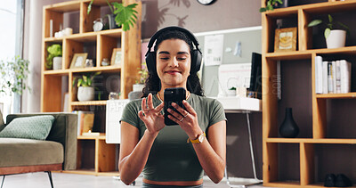 Buy stock photo Headphones, phone and woman in home for fitness, podcast and listening to audio online. Mobile, smile and girl with music for exercise album, sound and streaming radio for pilates in living room