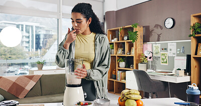 Buy stock photo Woman, blender and taste smoothie in kitchen for gut health, detox and supplements at apartment. Girl, machine and lick finger for flavor, diet and nutrition with organic fruits in morning at home