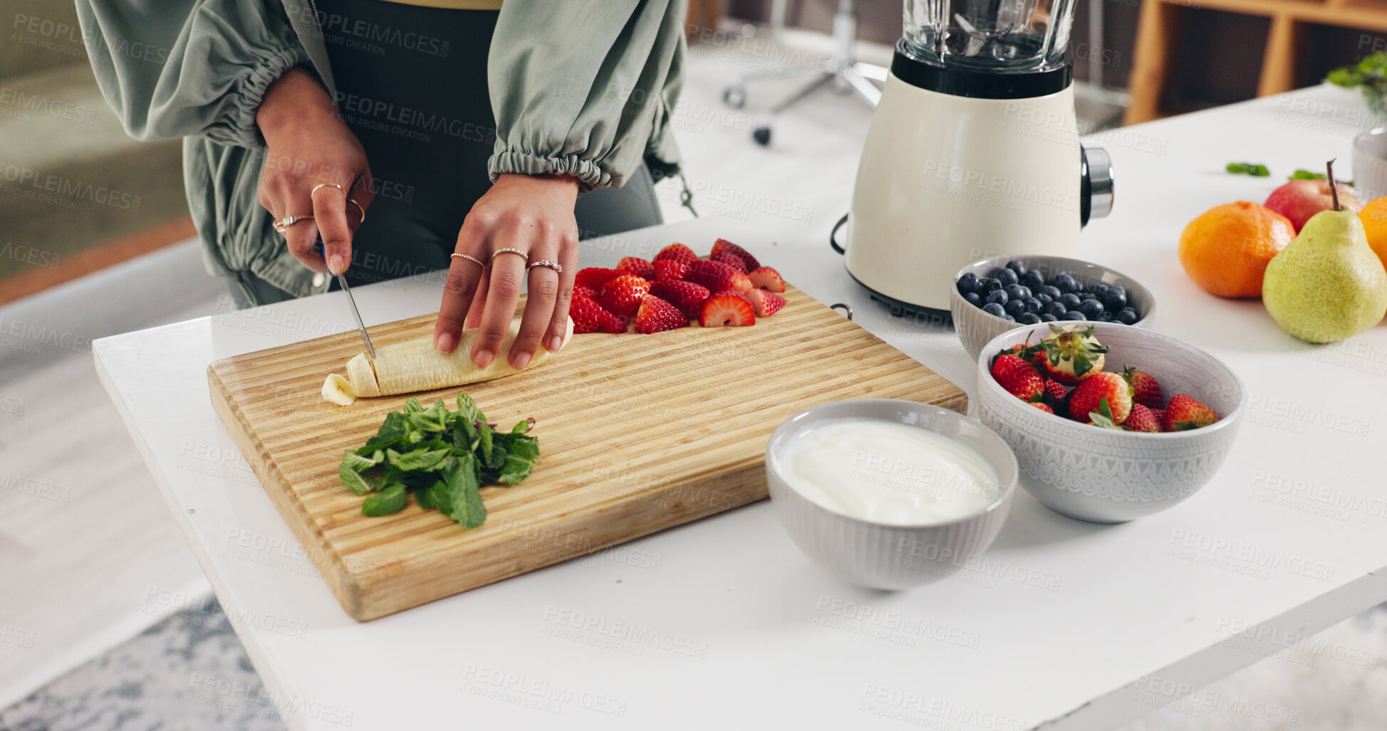 Buy stock photo Knife, hands and woman chop fruit in kitchen for smoothie, health or wellness snack in morning. Diet, nutrition and female person cutting organic ingredients for weight loss drink in apartment.