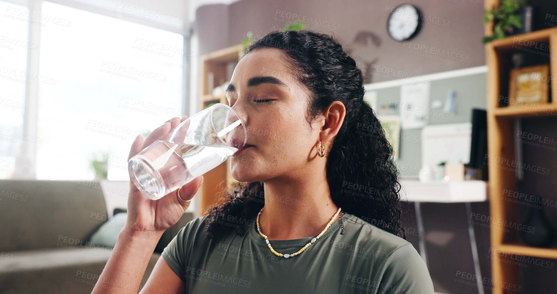 Buy stock photo Woman, drinking and water with glass in home for hydration, thirst or natural sustainability. Female person, relax and mineral liquid with cool beverage for fitness break, rest or recovery in house
