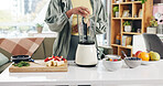 Hands, blender and fruits for smoothie in kitchen for gut health, detox and supplements at apartment. Person, machine and organic ingredients for vegan drink, diet or nutrition in morning at home