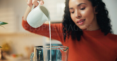 Buy stock photo Hands, blender and pour milk in kitchen for healthy drink, diet and supplement for detox at home. Person, machine and dairy product for benefits, nutrition and gut health with wellness at apartment