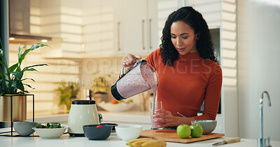 Buy stock photo Woman, smoothie or blender with diet in kitchen for health, nutrition or wellness in home. Female person, nutritionist or pour with natural organic fruit for drink, protein shake or vitamins in house