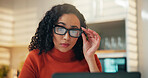Laptop, reading and remote work with woman in kitchen of home for small business or startup. Computer, glasses and information with freelance employee in apartment for online planning or research