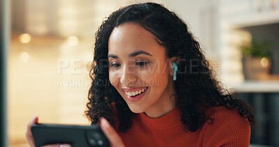 Buy stock photo Woman, phone and happy with earphones, home and online streaming with subscription for movies on web. Girl, smartphone and smile with video, film or series on mobile app with audio at apartment