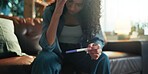 Worry, pregnant and woman with test on sofa for results, maternity news and anxiety for fertility crisis. Stress, home and person with medical kit for pregnancy symptoms, IVF failure and mistake
