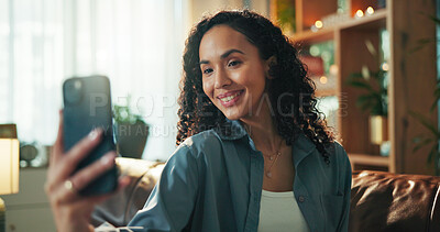 Buy stock photo Woman, smile and selfie on sofa in home, photography and post in living room for web audience. Girl, influencer and happy on couch with profile picture, video or live stream on social media at house