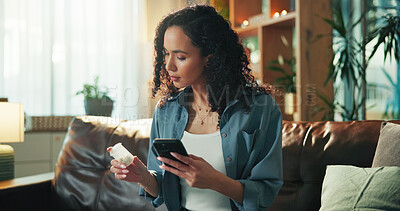 Buy stock photo Medication, phone and reading with woman on sofa in living room of home for prescription information. Container label, supplements or vitamins with person in apartment for healthcare research