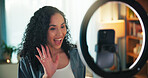 Phone, ring light and wave with influencer woman in living room of home for recording or streaming. Content creation, mobile and video with happy person greeting followers in apartment for broadcast