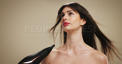Buy stock photo Cosmetics, hair care and woman with hairdryer on studio background for drying, thinking or heat. Mockup space, girl or beauty appliance for grooming routine, growth or contemplating keratin treatment