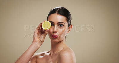 Buy stock photo Lemon, skincare and portrait with woman in studio for organic cosmetics, vitamin c benefits and glow. Natural product, self care and antioxidant with person on background for shine, beauty and space