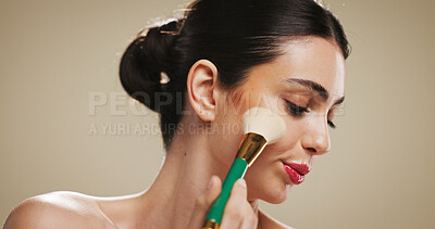Buy stock photo Glow, makeup and brush with woman in studio for blush, cosmetics and foundation application. Contour tools, powder and cosmetology with person on background for beauty, self care and shine space