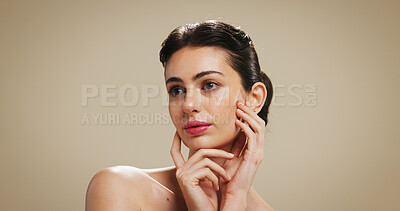 Buy stock photo Skincare, beauty and woman in studio with makeup for salon aesthetic, makeover and cosmetics. Dermatology, mockup space and face of person with facial glow, shine and self care on brown background