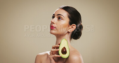 Buy stock photo Beauty, woman and skincare with avocado, studio background or vitamin c for facial treatment or glow. Mockup space, hydration and person with fruit for smooth skin, natural cosmetics and dermatology