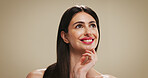 Haircare, happy and woman with long hair, beauty or cosmetics for healthy texture, growth or hairdo. Studio background, thinking and person with smile for shine, wellness and treatment for hairstyle