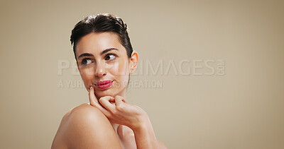 Buy stock photo Thinking, makeup and woman in studio for skincare, aesthetic or beauty with health. Face, lipstick cosmetics and model with thoughts, glow or facial transformation on brown background mockup space