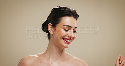 Buy stock photo Dance, happy and woman in studio for beauty, skincare and facial treatment on brown background. Mockup space, dermatology and smile of person with movement for cosmetics, salon aesthetic and glow