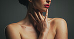 Cosmetics, red lipstick and shoulders of woman in studio with beauty, self care or makeup. Skincare, cosmetology and female person with natural body glow for dermatology routine by black background.