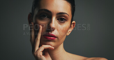 Buy stock photo Portrait, beauty and confident woman with makeup in studio with collagen, aesthetic or space. Face, serious model or lipstick cosmetics for skincare, dermatology or self care on dark background