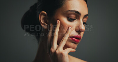 Buy stock photo Skincare, beauty and woman with makeup in studio with collagen, aesthetic or hydration. Facial, serious model or lipstick cosmetics for dermatology, cosmetology and self care on gray background