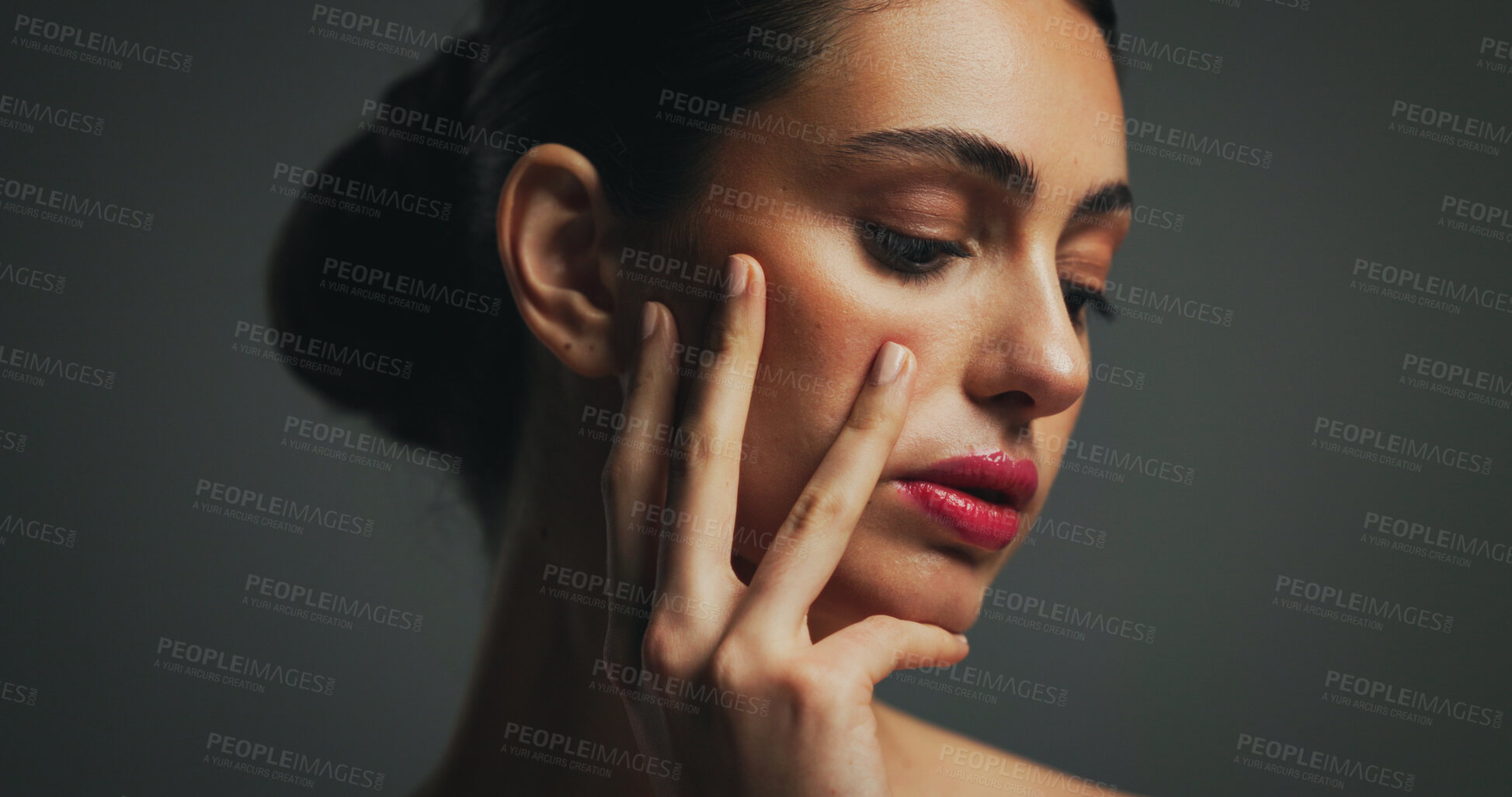 Buy stock photo Skincare, beauty and woman with makeup in studio with collagen, aesthetic or hydration. Facial, serious model or lipstick cosmetics for dermatology, cosmetology and self care on gray background
