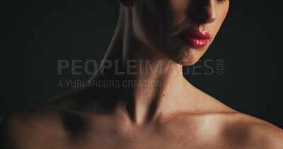 Buy stock photo Shoulder, beauty and glow with woman in studio for dermatology, body care and hygiene. Collagen benefits, aesthetic and shine with closeup of person on black background for grooming and red lipstick