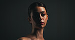 Portrait, beauty and woman with makeup in studio with collagen, aesthetic or space. Face, serious model or lipstick cosmetics for skincare, dermatology or self care for confidence on black background