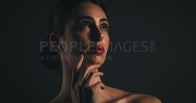 Buy stock photo Thinking, black background and woman with beauty in studio for skincare, healthy skin and glow. Dermatology, mockup space and female person for facial treatment, aesthetic and anti aging cosmetics