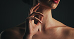 Shoulder, skincare and hand of woman in studio for dermatology, body care and hygiene. Collagen benefits, aesthetic and shine with closeup of person on black background for space, grooming and touch